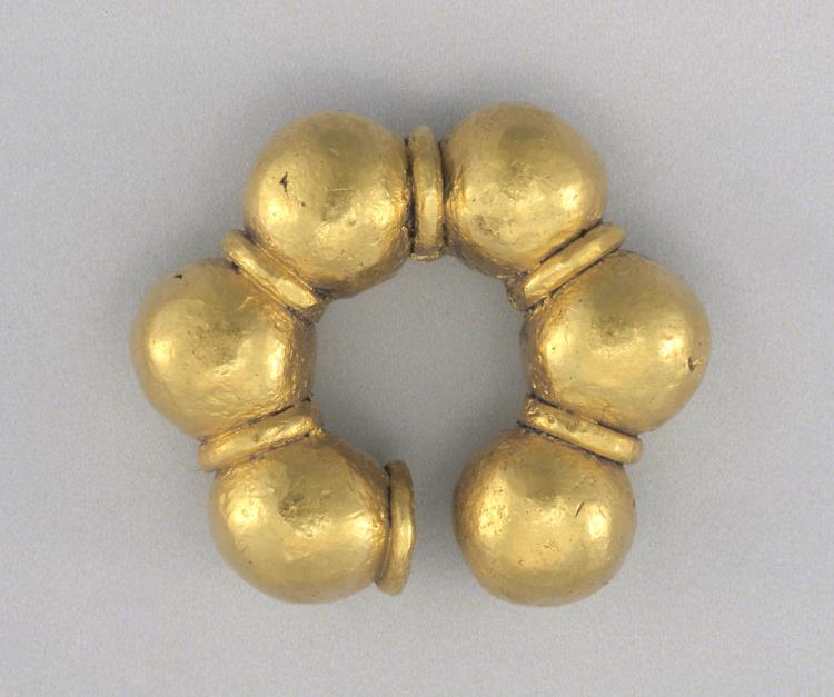 6 gold beads on a ring
