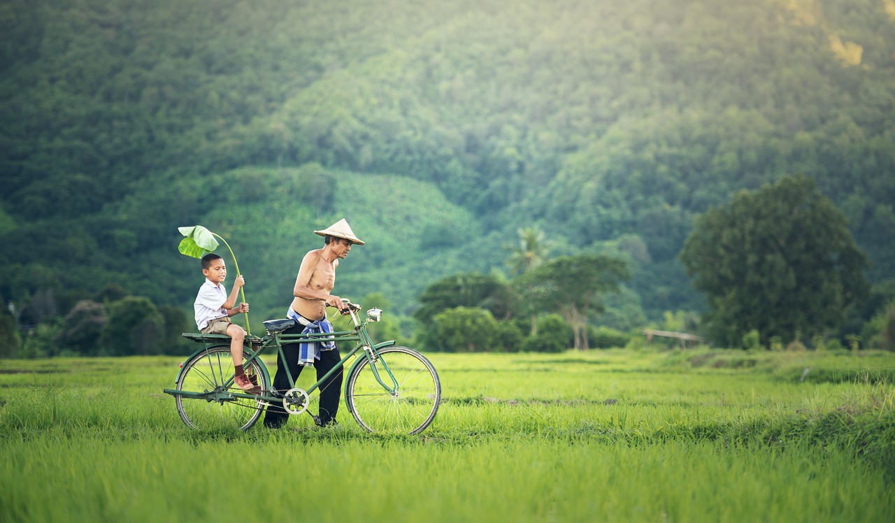 Father and son with bike