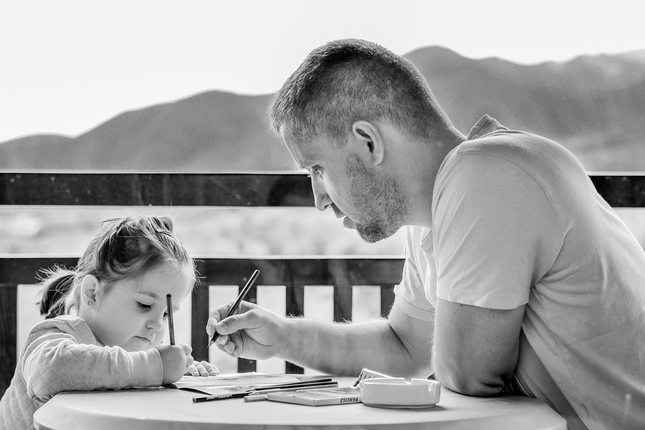 father teaching daughter