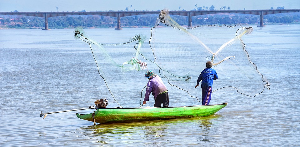 Cast-net fishing on the Mekong River in Laos.