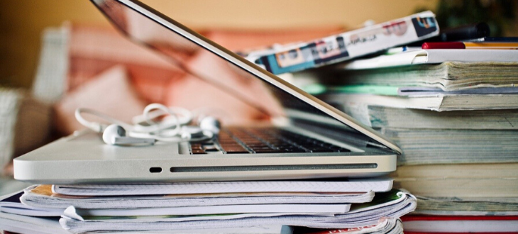 laptop on books