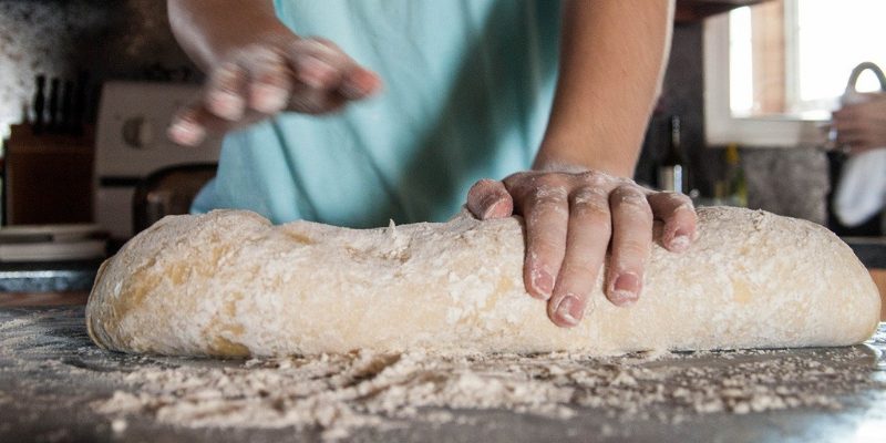 Person kneading bread dough