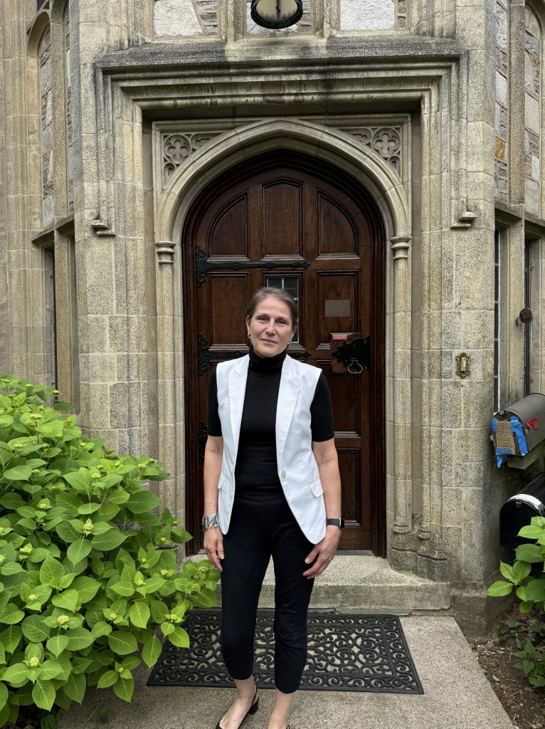 woman standing in front of a door